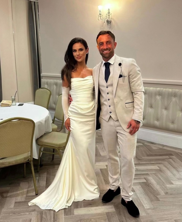 Bride and groom, Ellie and Alex, posing on their wedding day after choosing an affordable holiday and dining at McDonald's Drive-thru
